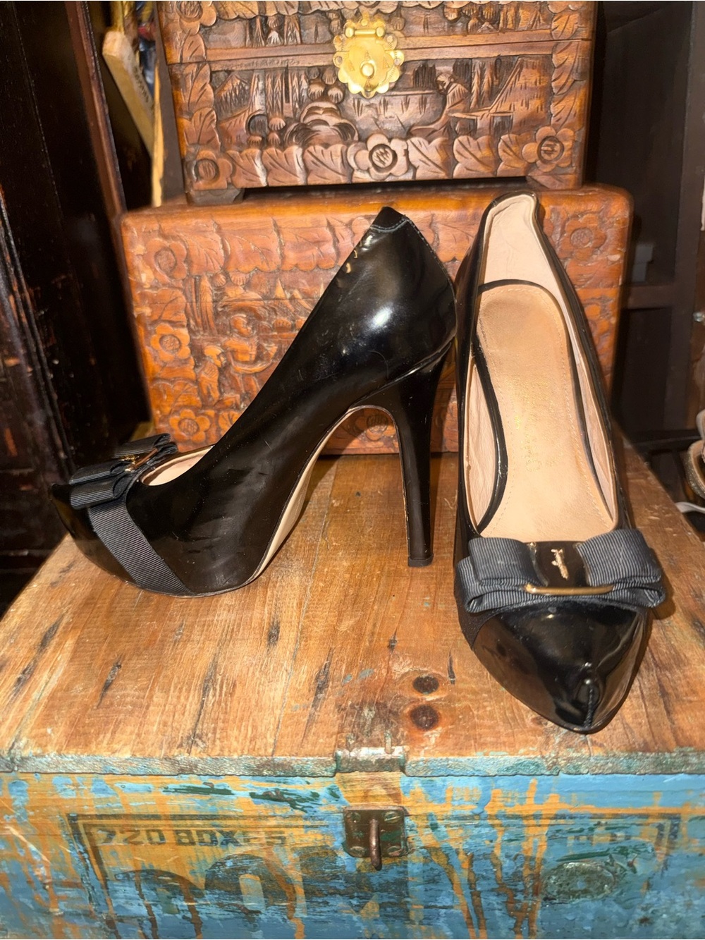 Salvatore Ferragamo Black Patent featuring iconic gold plate & grosgrain bow